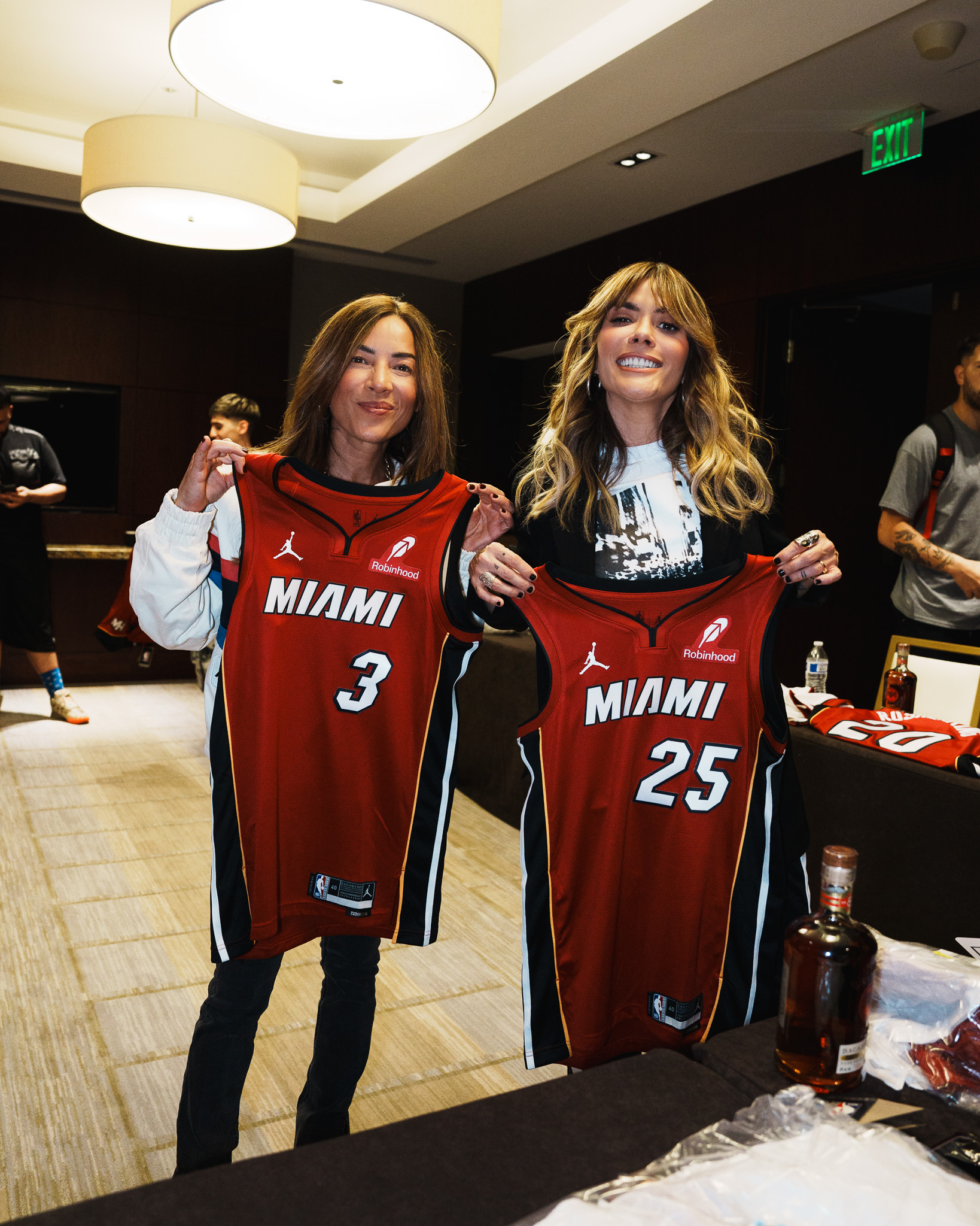 Guests holding Miami Heat jerseys backstage at the Sony Music event
